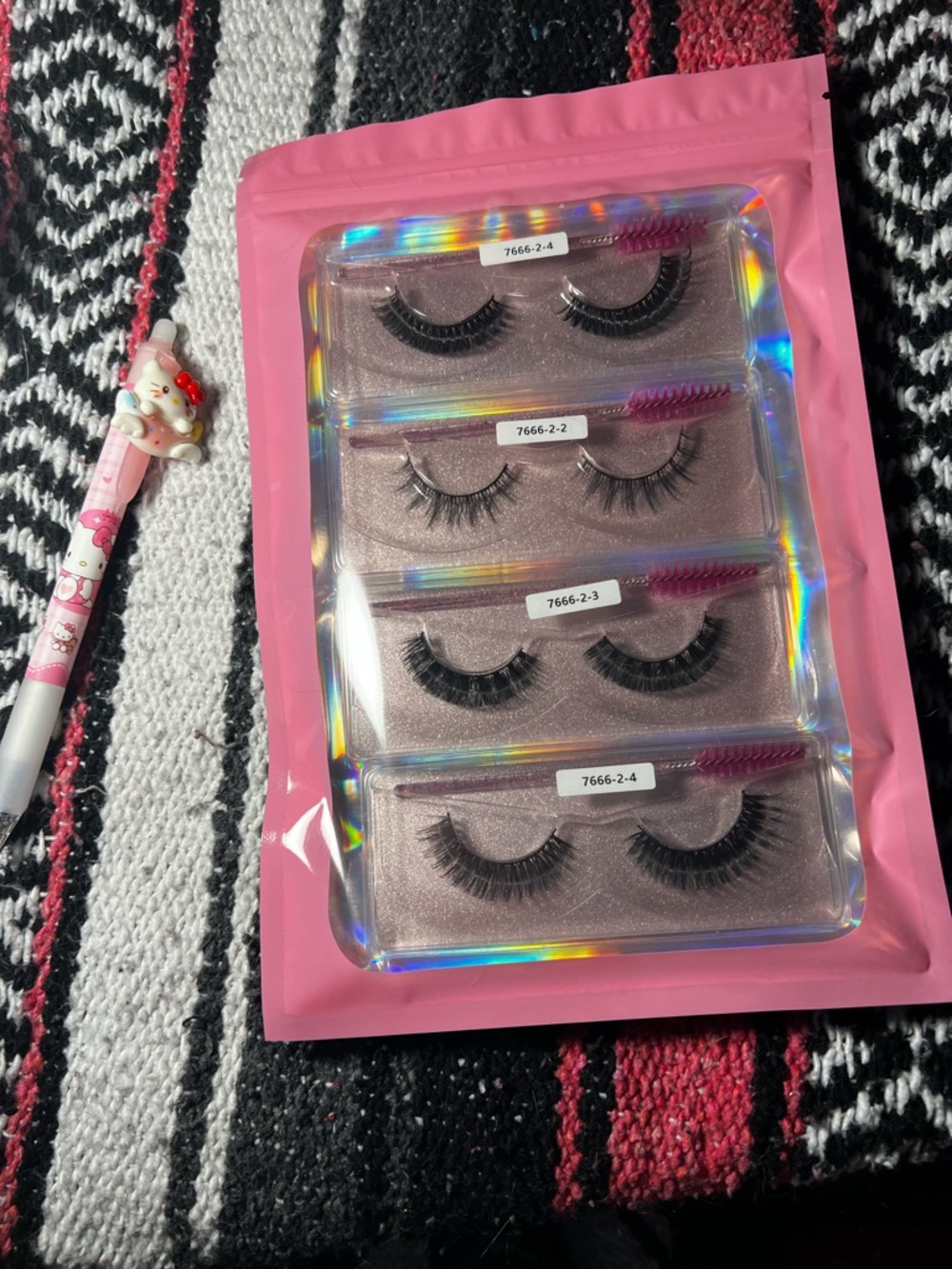 Set of 4 Black False Eyelash Pairs in Pink Holographic Packaging